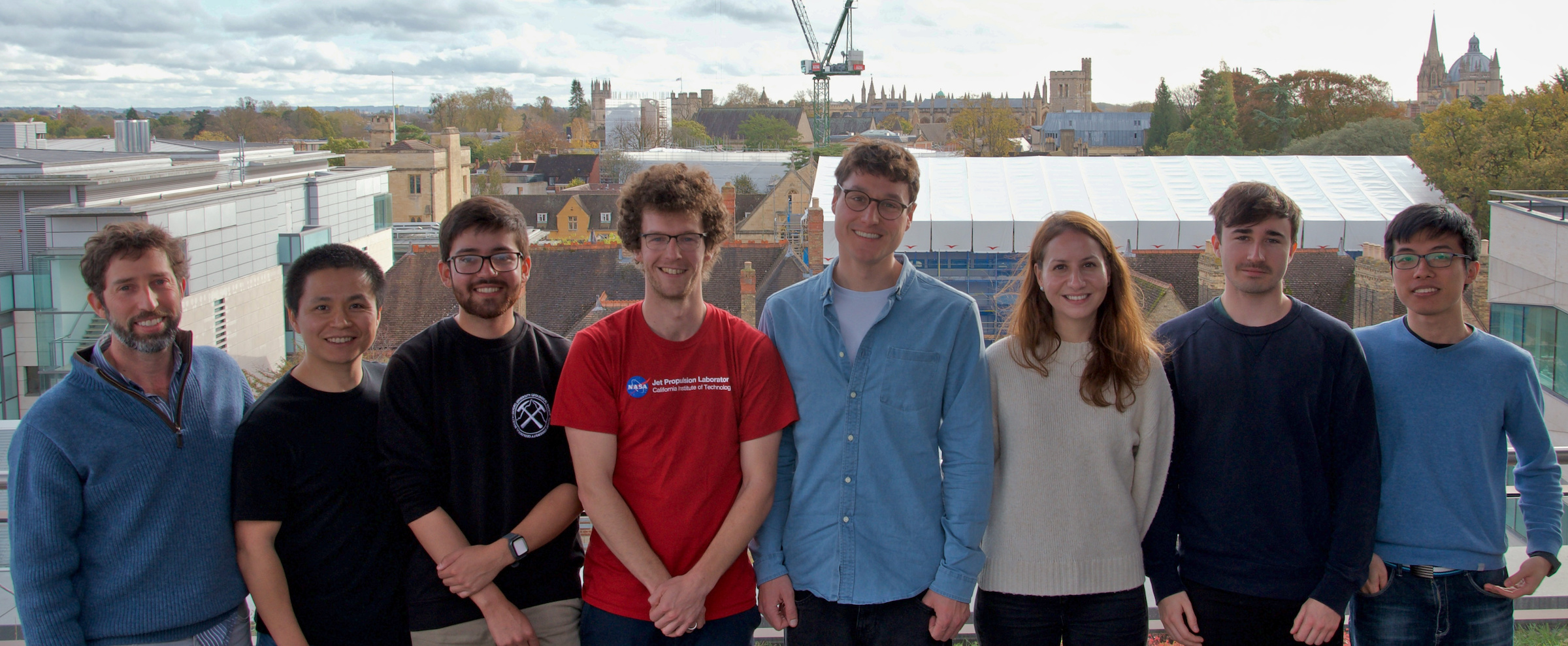 Group photo of the members of the Foalab in November 2022 standing on the balcony of the Earth Sciences Department in Oxford