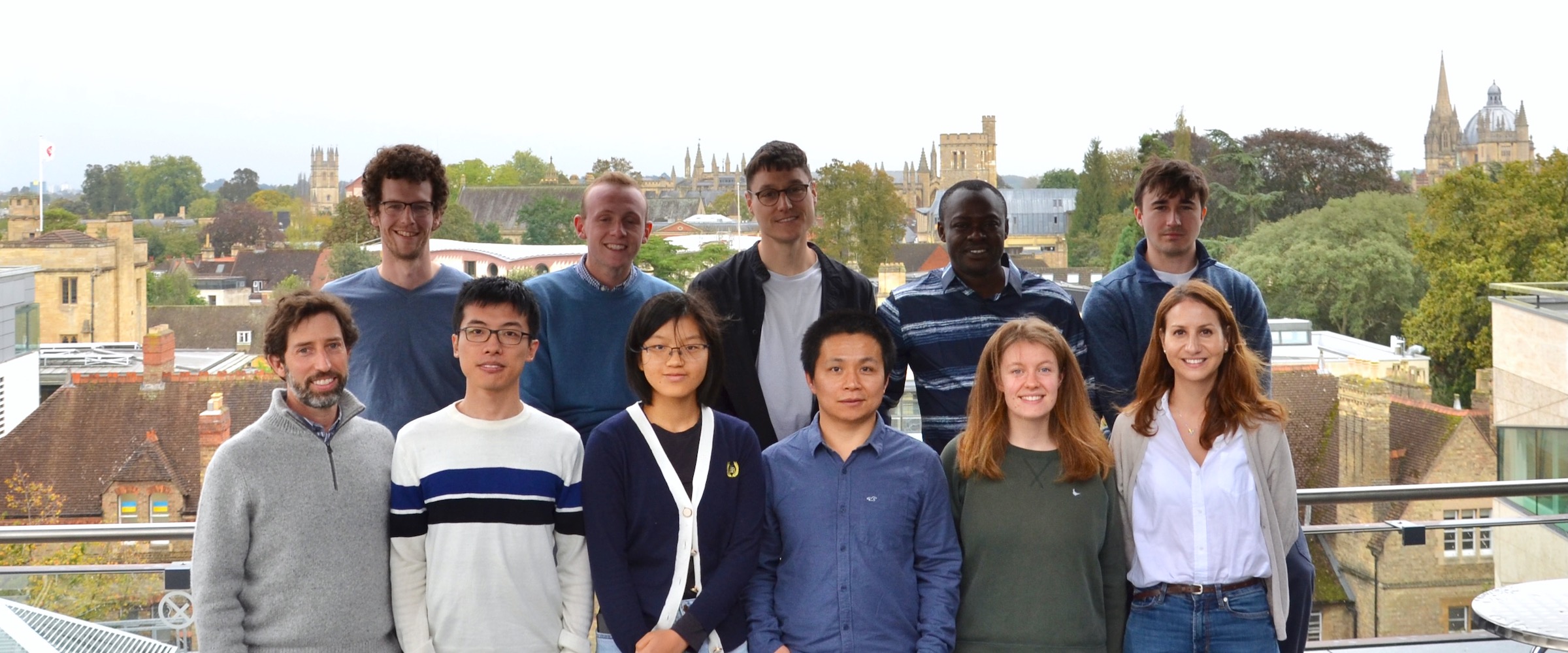 Group photo of the members of the Foalab in October 2023 standing on the balcony of the Earth Sciences Department in Oxford